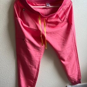 FIGS Women’s Zamora Joggers - Petite Medium in color Neon Pink